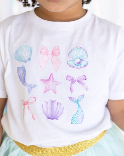 Girl wearing white mermaid graphic t-shirt 