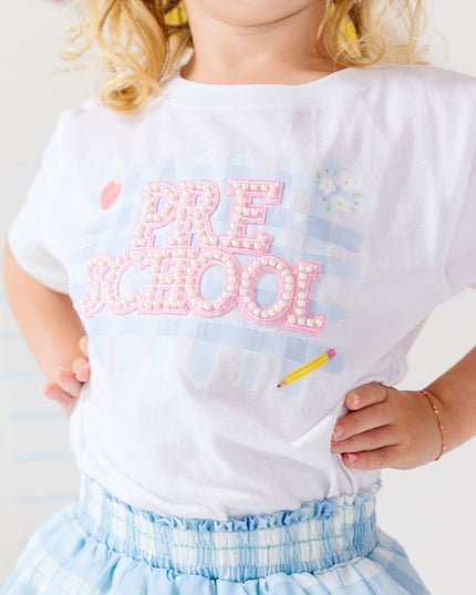 Girl wearing White T-Shirt with Pre-School Pearl Patch