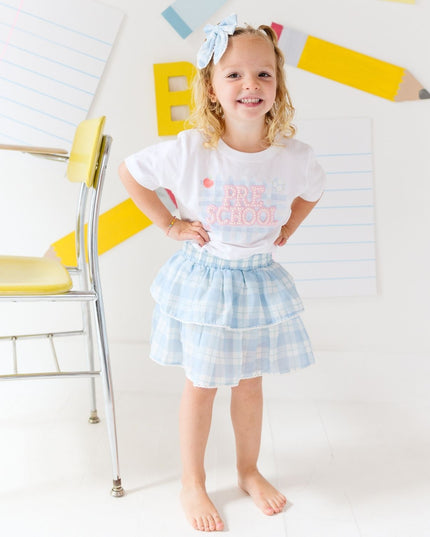 Girl wearing White T-Shirt with Pre-School Pearl Patch