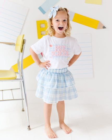 Girl wearing White T-Shirt with Pre-School Pearl Patch