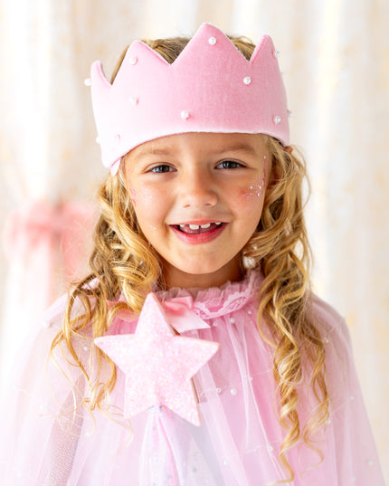 girl wearing pink and pearl dress up kit