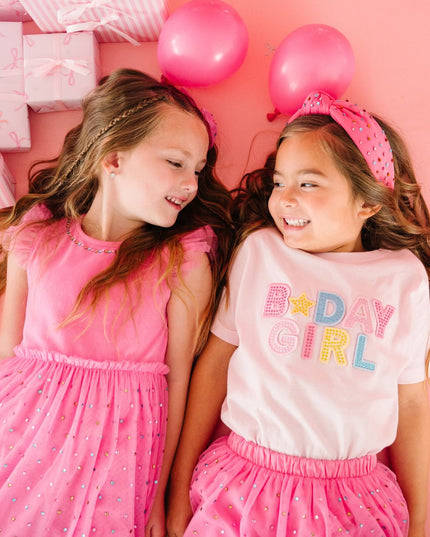 Girls wearing pink rhinestone birthday outfits