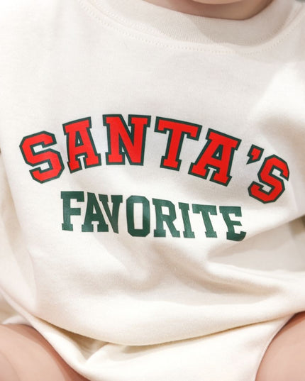 Baby wearing baby Romper with Santa's Favorite Graphic in Red and Green