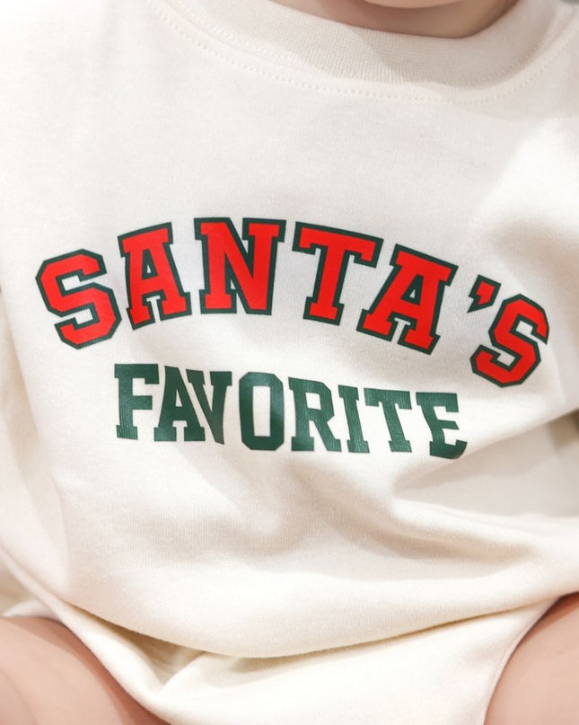 Baby wearing baby Romper with Santa's Favorite Graphic in Red and Green