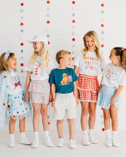 Kids wearing fun red, white and blue outfits