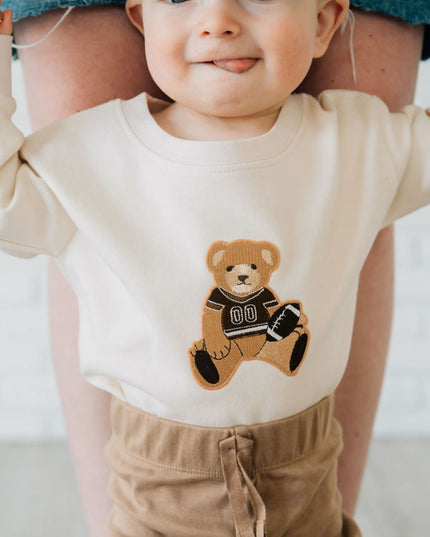 Baby wearing Long Sleeve Romper with Teddy Bear Football Patch