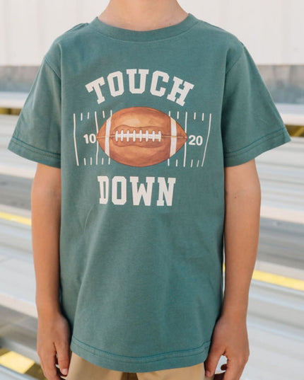 Boy wearing Green t-shirt with touch down football graphic
