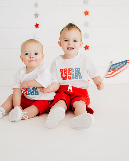 kids wearing white shirts with USA graphic