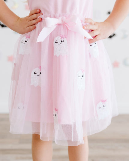 A girl wearing a pink tutu dress with sequin 'Boo' and ghost details