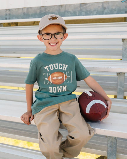 Boy wearing Green t-shirt with touch down football graphic