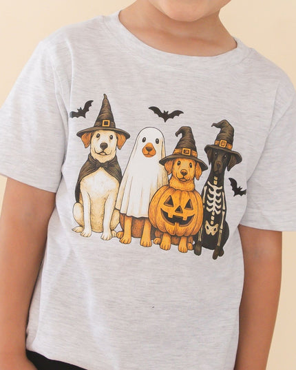 A young boy wearing a light gray heather t-shirt with a graphic of four dogs dressed in Halloween costumes 