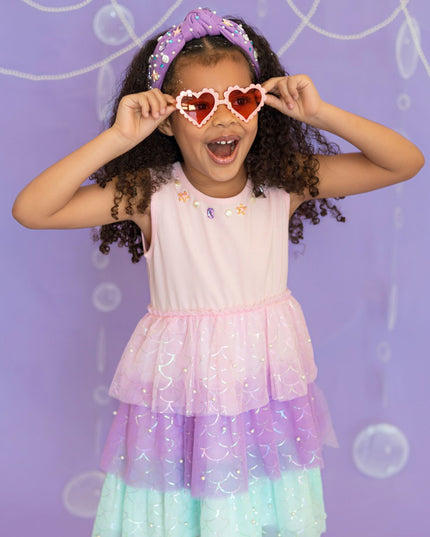 Girl wearing pink, purple, and green tutu mermaid dress 