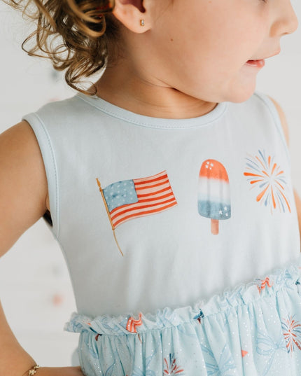 Girl wearing blue dress with patriotic pattern