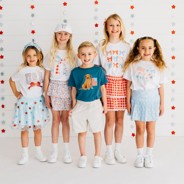 Kids wearing fun red, white and blue outfits