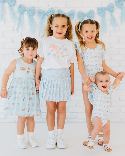 Kids wearing fun red, white and blue outfits