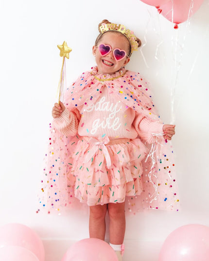 Girl wearing pink birthday outfit