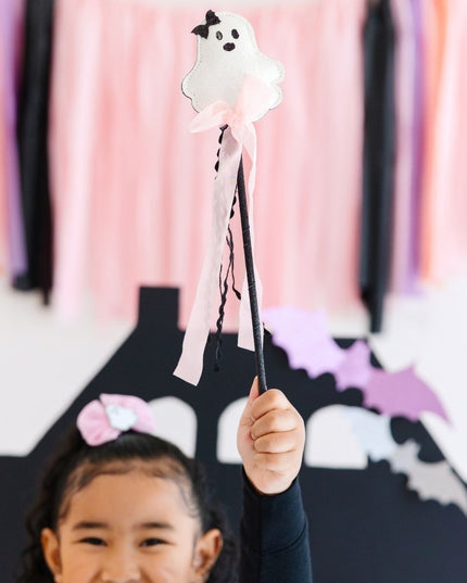 Girl holding Coquette Ghost Halloween Wand