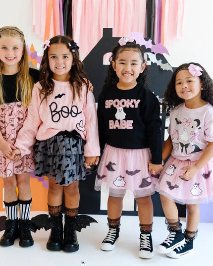Girls wearing various halloween outfits