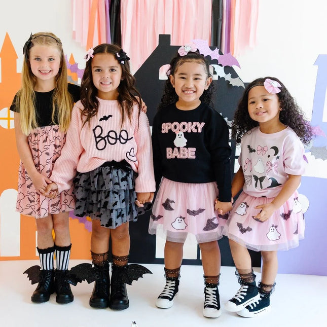 Girls wearing various halloween outfits