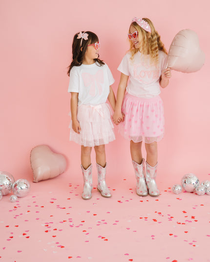 Girls wearing Valentine's Day outfits