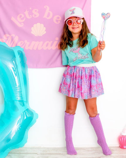 Girl wearing mermaid inspired outfit