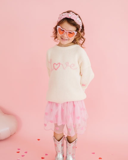 Girl wearing love sweater with pink tutu with sequin hearts