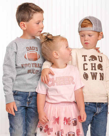Kids wearing festive game day football outfits