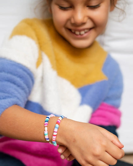 Child wearing colorful bracelets 