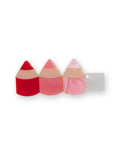 Hair clip with 3 red colored pencils