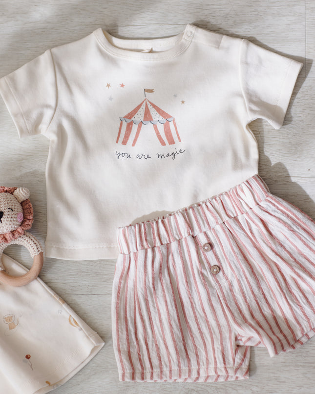 You are magic tee shirt and red and white striped shorts with buttons
