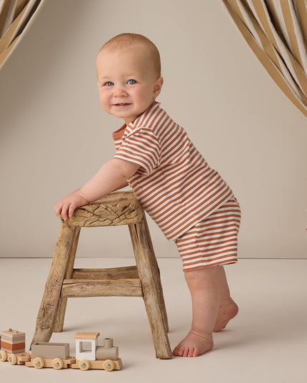 Baby wearing striped shirt and shorts set 