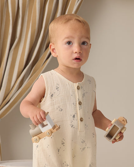 Baby wearing Button down romper with delicate space print
