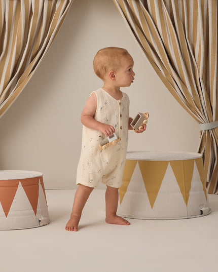 Baby wearing Button down romper with delicate space print
