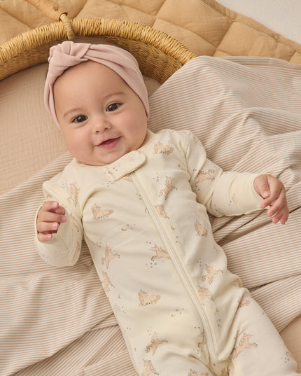 Baby wearing Longsleeve zip pajamas with unicorn print