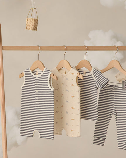 Baby outfits hanging on a clothing rack