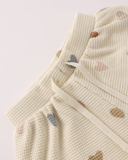 Cream colored top and short set with confetti heart print