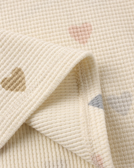 Cream colored top and short set with confetti heart print