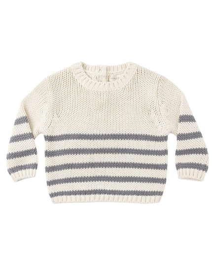 A cream-colored knit sweater with horizontal gray stripes across the lower half and on the sleeves