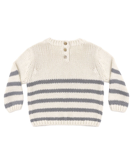 A cream-colored knit sweater with horizontal gray stripes across the lower half and on the sleeves
