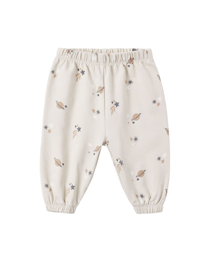 A pair of kids sweatpants with an all over space print. 