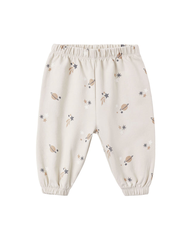 A pair of kids sweatpants with an all over space print. 
