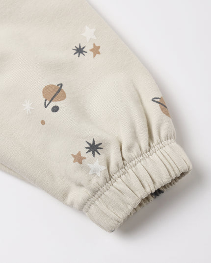 A pair of kids sweatpants with an all over space print. 
