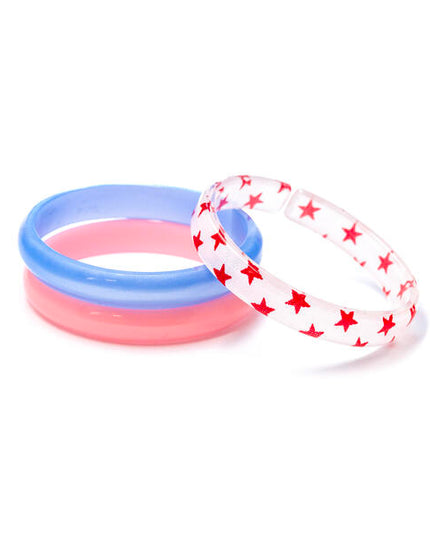 Bangle set featuring one red bracelet, one blue bracelet and one white bracelet with red stars