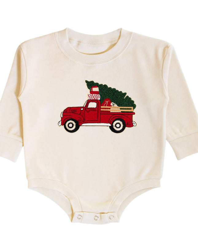 Natural color long sleeve romper with a red tuck carrying a Christmas tree patch