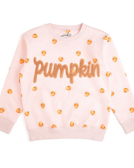 Pink crewneck sweatshirt with pumpkin pattern and patch that reads 'pumpkin'