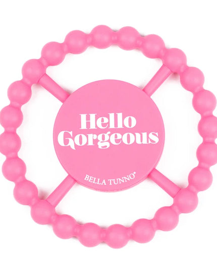 Pink silicone teething ring with 'hello gorgeous' text