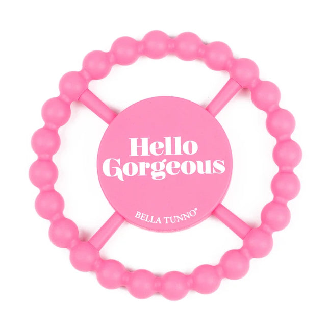 Pink silicone teething ring with 'hello gorgeous' text