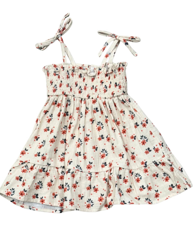 White tiered dress with floral print and tied sleeves