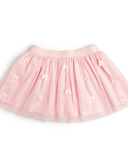 A light pink tulle tutu skirt with small bow embellishments