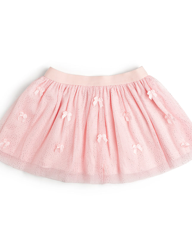 A light pink tulle tutu skirt with small bow embellishments